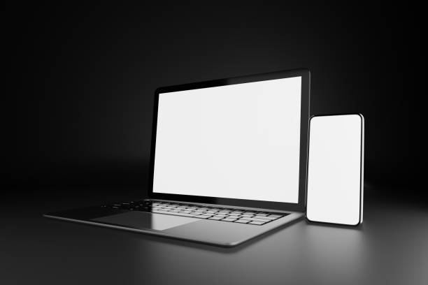 istock 3D illustration rendering object. Laptop computer silver and black color with smartphone mobile blank screen in dark theme 1355060034