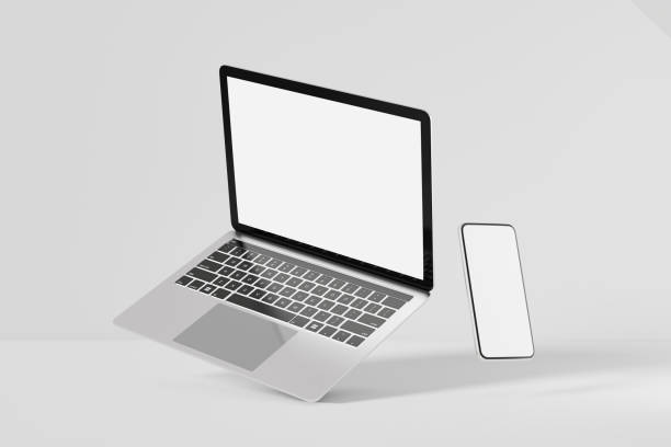 istock 3D illustration rendering object. Laptop computer silver and black color with smartphone mobile blank screen. 1355060046