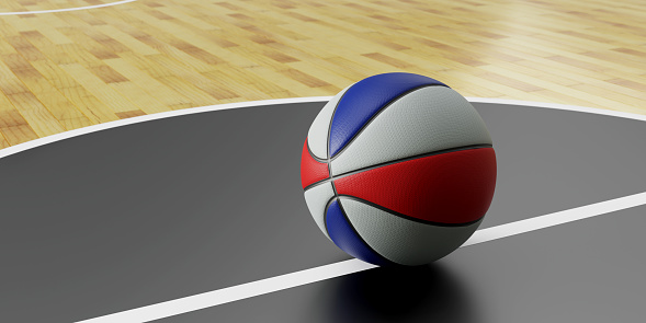 New, orange basketball ball on a dark surface.