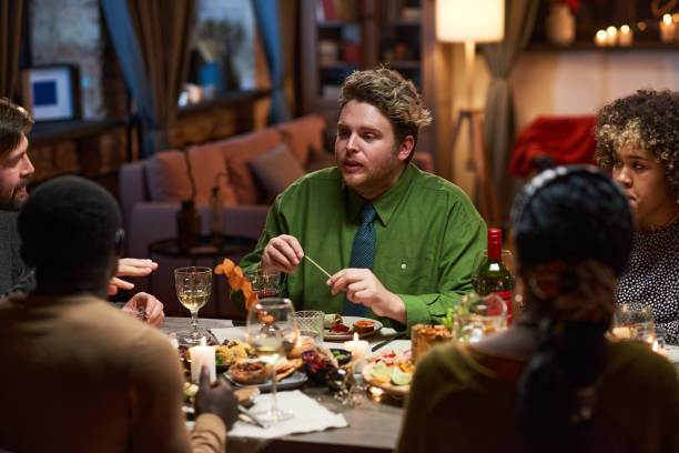 istock Friends meeting at dinner party 1355060622