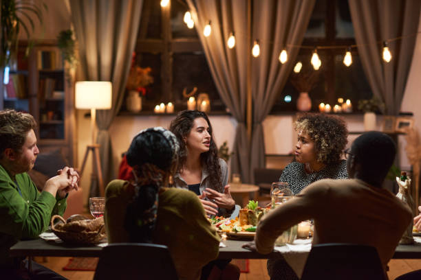 istock Friends meeting during a dinner party 1355060643