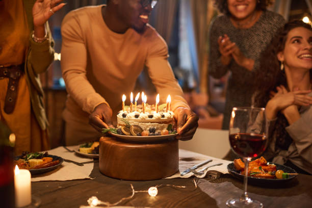 istock Birthday cake at a birthday party 1355061566