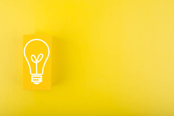 istock Creativity, innovation and idea concept. Light bulb drawn on yellow rectangle on yellow background with copy space 1355062095