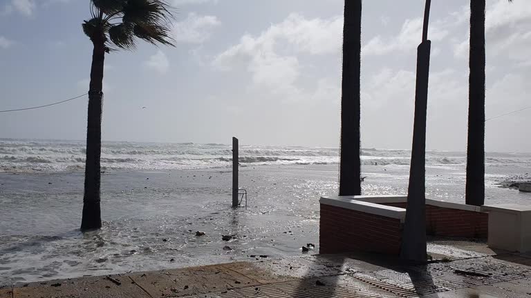 Strong waves sweeping the beach due to the strong wind. Estepona, Costa del Sol, Spain. Beach called "La Rada"