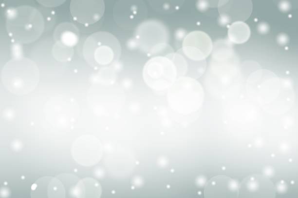 istock Gray blue abstract background. white bokeh snowflakes blurred beautiful shiny lights. use for Merry Christmas, happy new year wallpaper backdrop and your product. 1355063489