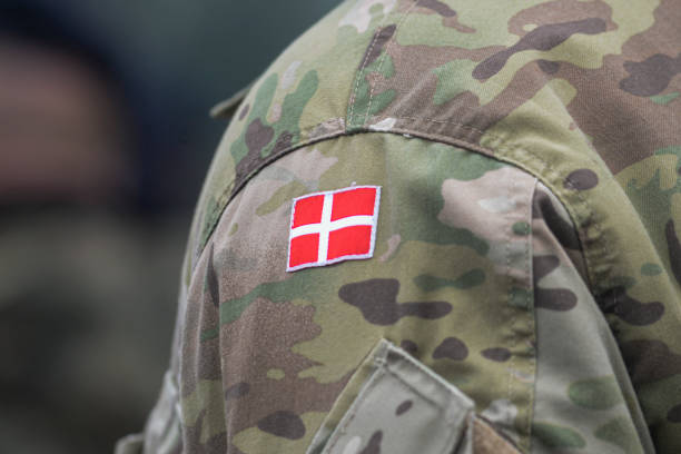istock Danish army uniform with the Danish flag on the shoulder. Danish military, selective focus. 1355064941