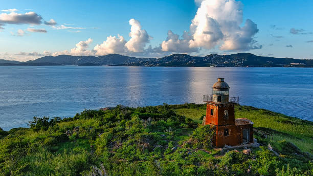 Buck Island Lighthouse Buck Island Lighthouse is located south of St. Thomas in the US Virgin Islands. It is a migratory bird refuge. The lighthouse was built in 1916 and has survived numerous hurricanes to stand as one of the oldest lighthouses in the Caribbean st. thomas virgin islands photos stock pictures, royalty-free photos & images