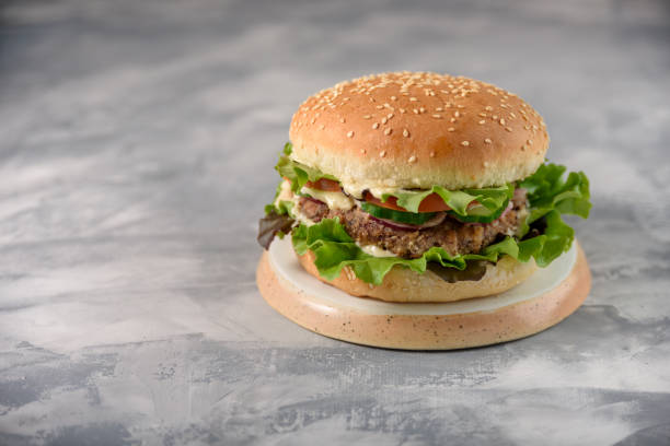 istock Vegetarian burger with bean patty 1355069129