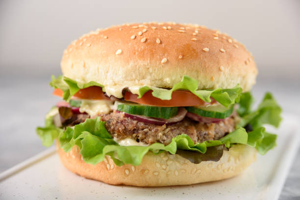 istock Vegetarian burger with bean patty 1355069754