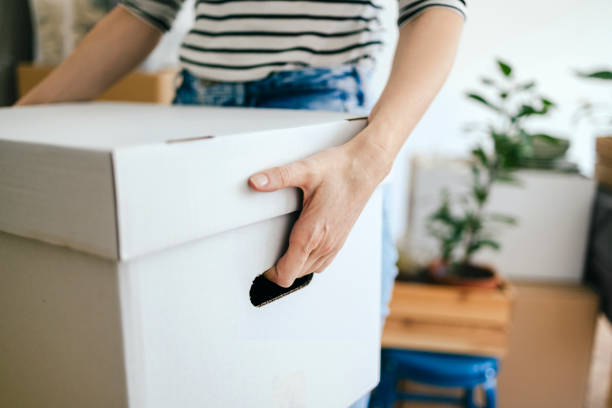 istock An Anonymous Woman Moving In Into New Apartment 1355069808