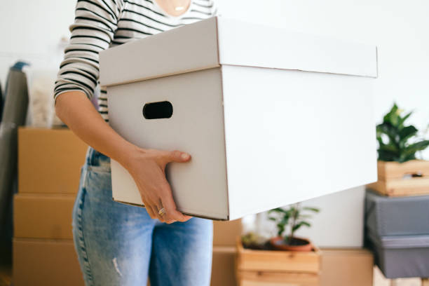 istock An Anonymous Woman Moving In Into New Apartment 1355069823