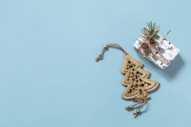 istock Christmas mockup with Christmas presents on a blue background. Preparation for celebration xmas. Top view flat lay background. Copy space. 1355069967