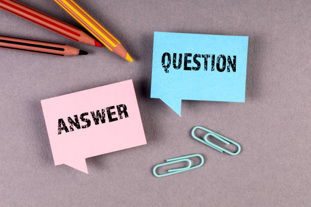 istock Question and Answer concept. Speech bubbles and pencils on a gray background 1355070050