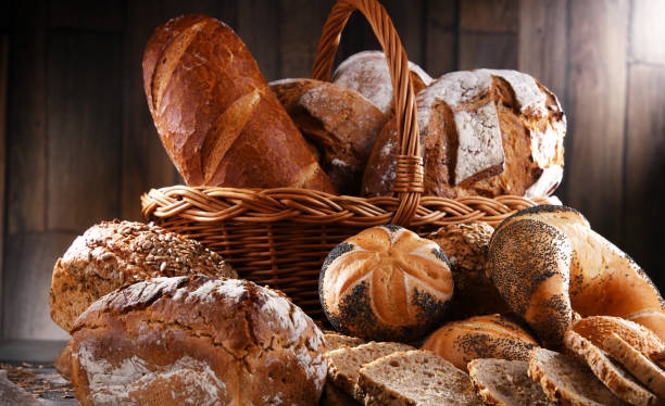 istock Assorted bakery products including loafs of bread and rolls 1355070058