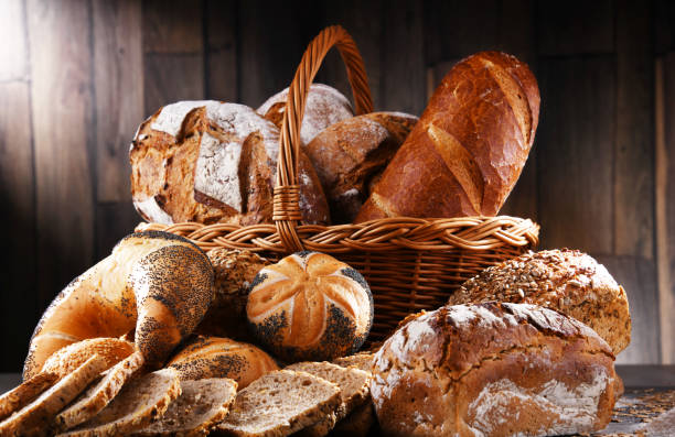 istock Assorted bakery products including loafs of bread and rolls 1355070273