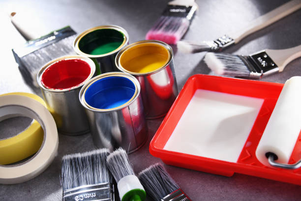 istock Paintbrushes of different size and paint cans 1355070410