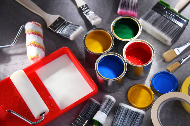 istock Paintbrushes of different size and paint cans 1355070440