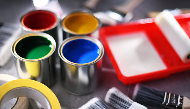 istock Paintbrushes of different size and paint cans 1355070485