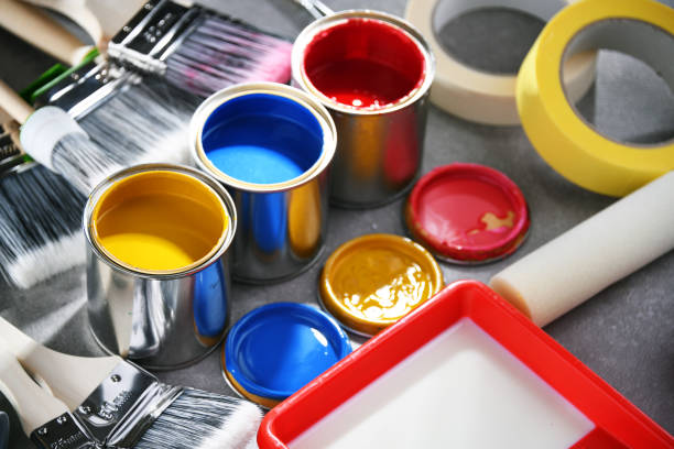 istock Paintbrushes of different size and paint cans 1355070498