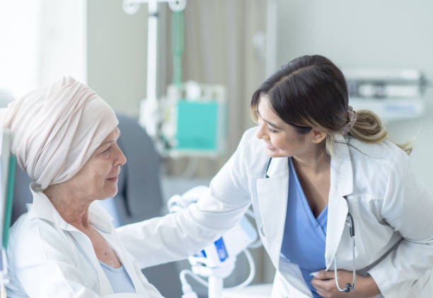 istock Doctor Checking on a Cancer Patient 1355071700