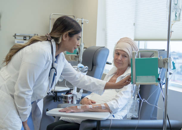 istock Doctor Changing a Chemotherapy Dosage 1355071714