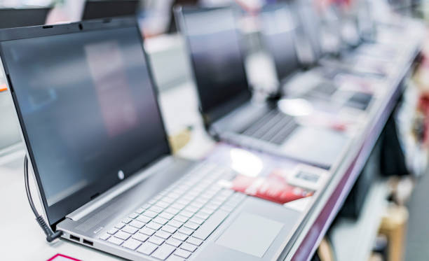 istock Laptop computers put up for sale in a store 1355073357