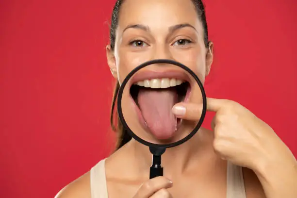 Photo of Woman showing her healthy tongue