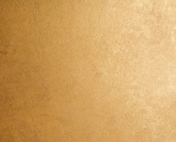 istock Gold beige color paper texture abstract background 1355079743