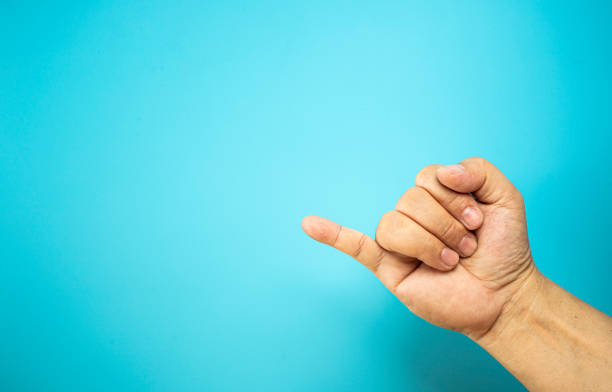 istock Hand with many actions meaning on the blue background with copy space 1355079923