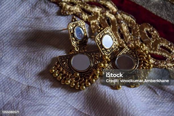 Stock Photo Of Beautiful Indian Jewelry Golden Mirror Zumka Or Earring On White Background Traditional Indian Trendy Jewelry Focus On Object At Bangalore City Karnataka India Stock Photo - Download Image Now