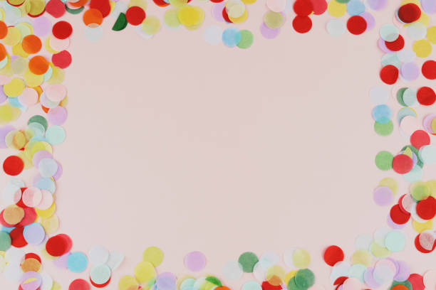 istock Confetti multicolor on a pink background. Top view, copy space 1355083136