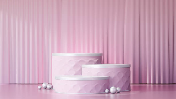 istock 3D rendering background. Three pink cylinder stage podium display products with a lite pink curtain wall. Image for presentation. 1355083890
