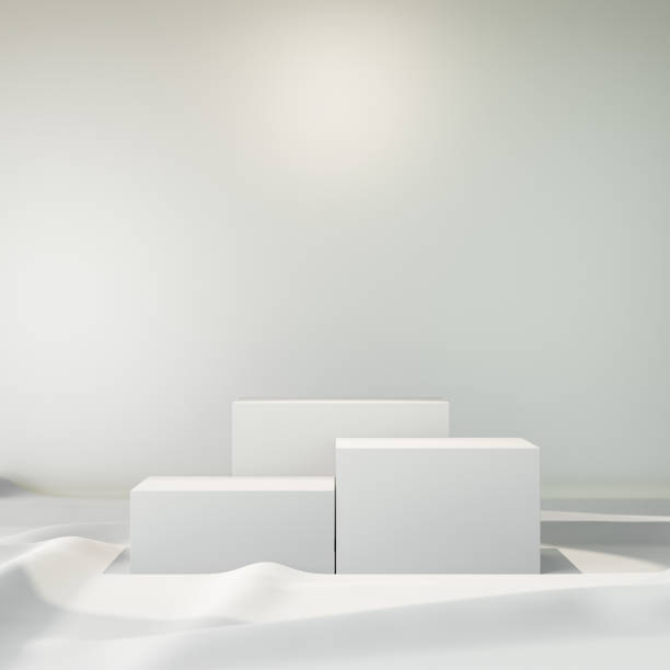 istock 3D rendering background. Three white box stage podium on white cloth floor. 1355083928