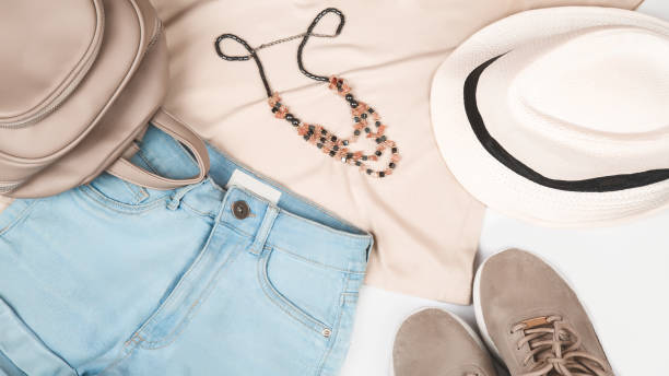 istock Women's casual summer clothes with elements of accessories on white background, top view, flat lay 1355086076