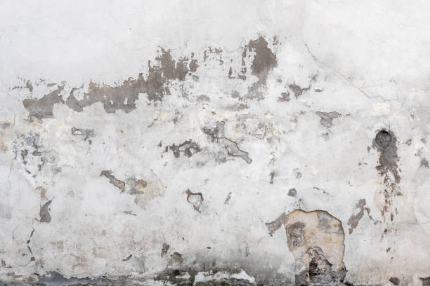 istock material texture of damaged and cracked plaster wall, surface background 1355086107