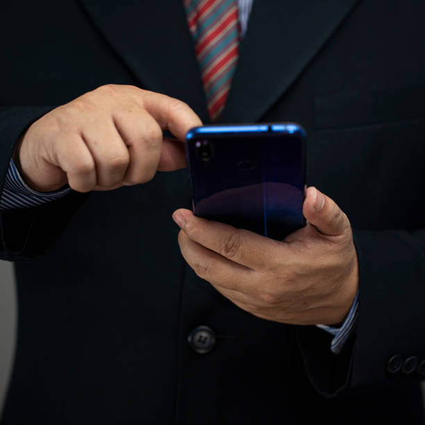 istock Mobile phone in the hand on the white background with copy space 1355088970
