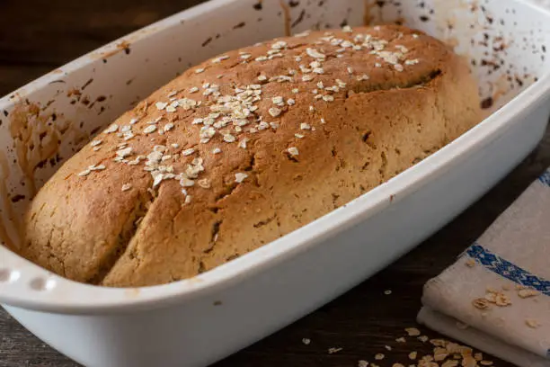 Healthy bread baked with rolled oats and baking powder. Served in a rustic bread mold