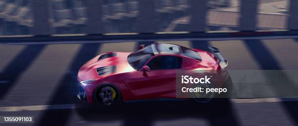 Generic Red Electric Sports Car Moving At High Speed Along A Tunnel Above Urban Surroundings Stock Photo - Download Image Now