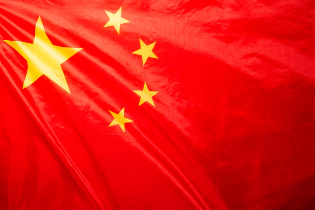 istock China flag waving as a background. 1355092213