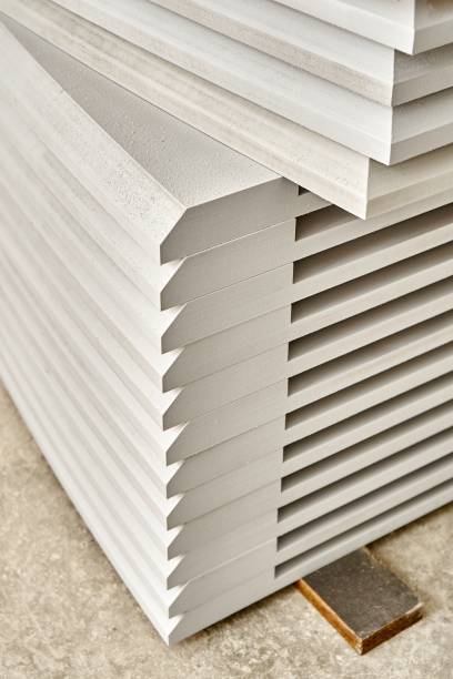 istock Tabletops made of mdf covered with white primer in sanding workshop 1355092806