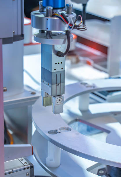 istock Robot arm with test tube for biological experiments in laboratory 1355093029