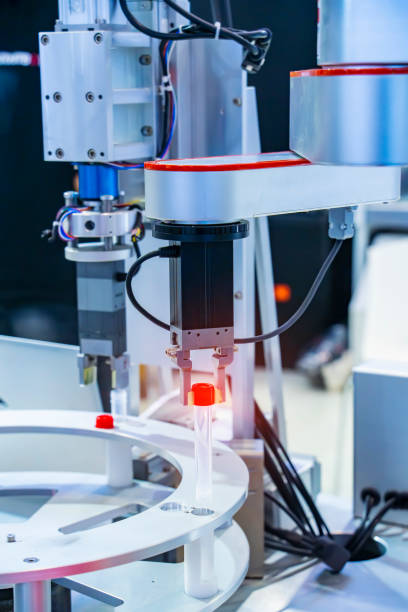 istock Robot arm with test tube for biological experiments in laboratory 1355093066