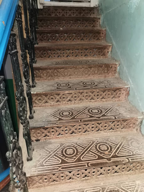 istock Entrance and old cast-iron staircase 1355094198