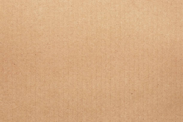 fond abstrait en feuille de carton brun, texture de la boîte en papier recyclé dans un ancien motif vintage pour les œuvres d’art de conception. - brown paper paper striped corrugated cardboard photos et images de collection
