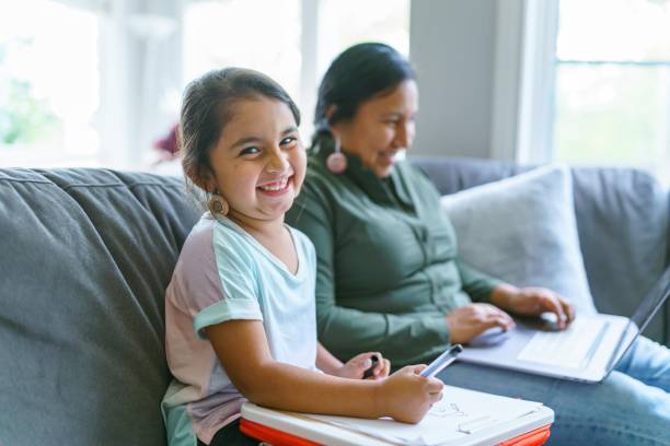 istock Happy Native American girl spending time with her mom 1355105810