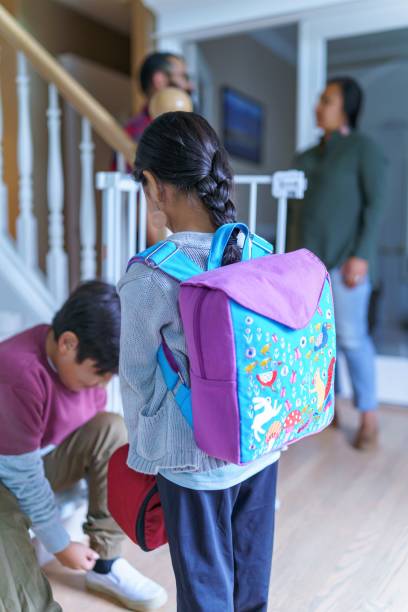 istock Siblings getting ready to walk to school 1355105837