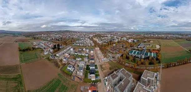 Drone panorama over Hessian spa town Bad Nauheim during the day with cloudy sky in autumn