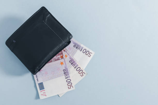 istock Black wallet and 500 euro bills on gray 1355106949
