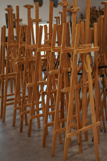 istock Photo of empty easels being in art studio 1355106987