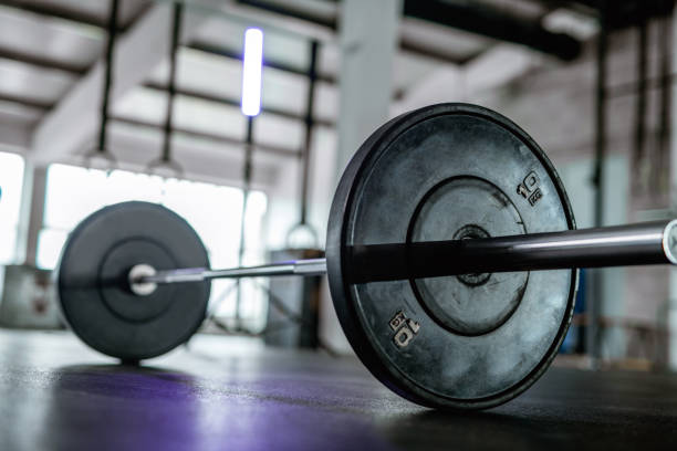 istock Barbell and Weights in Cross Training Facility 1355109484